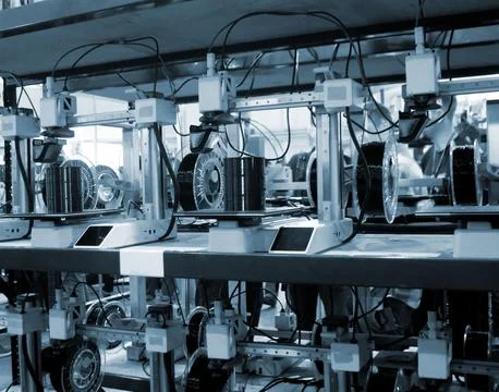 Many 3D printers printing object. 3D printers creating shape from molten plastic Stock Photos
