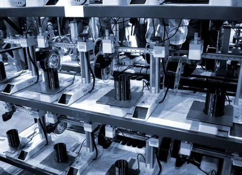 Many 3D printers printing object. 3D printers creating shape from molten plastic Stock Photos