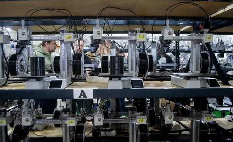 Many 3D printers printing object. 3D printers creating shape from molten plastic Stock Photos