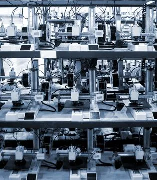 Many 3D printers printing object. 3D printers creating shape from molten plastic Stock Photos