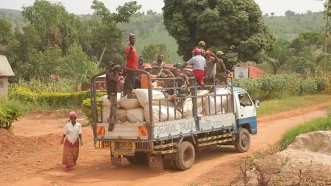 Many African men workers stand on car loaded with bags, asks for payment filming Stock Footage 209900111