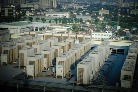 Many air conditioning cooling systems are placed on the floor of high rise bu Stock Photos