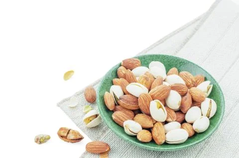 Many almonds in dish. 스톡 사진