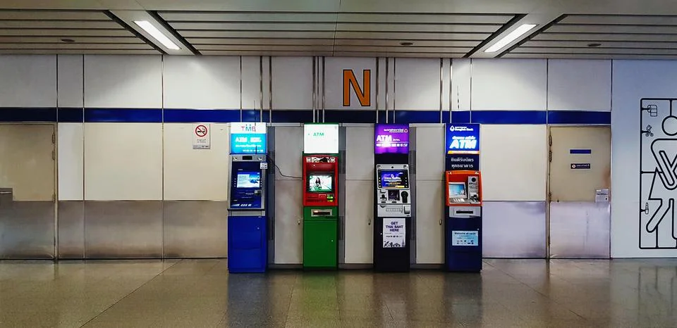 Many ATM (Automatic Teller Machine) install in building for service people Stock Photos