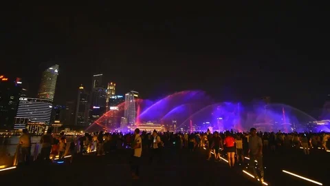Many audiences are watching Light and water show at Marina Bay Sands Stock Footage 79552119