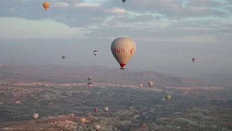 Many balloons flying over the valleys in Goreme, Turkey. Stock Footage 157690154