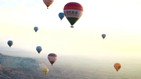 Many balloons flying over the valleys in Goreme, Turkey. Stock Footage 157690155