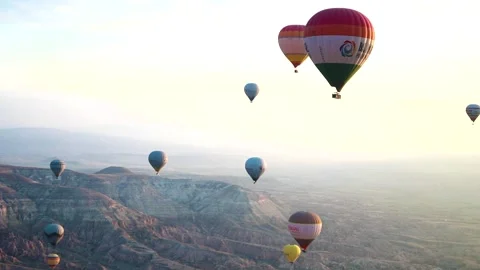 Many balloons flying over the valleys in Goreme, Turkey. Stock Footage 157690158