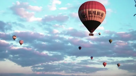 Many balloons flying over the valleys in Goreme, Turkey. Stock Footage 157690188