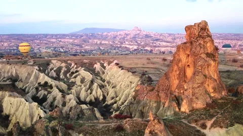 Many balloons flying over the valleys in Goreme, Turkey. Stock Footage 157690202