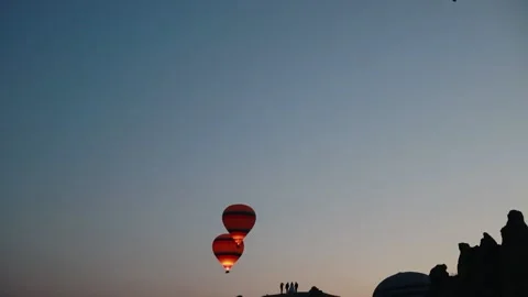 Many balloons flying over the valleys in Goreme, Turkey. Stock Footage 157690261