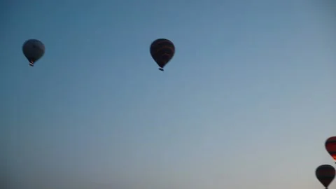 Many balloons flying over the valleys in Goreme, Turkey. Stock Footage 157690265