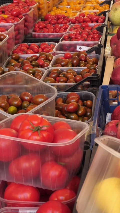 Many Baskets of Cherry Tomatoes at a Colorful Italian Produce Market Stock-Footage 335695425