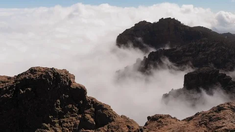 Many beautiful clouds, mountains of volcanic origin, view from a height. Pico de Stock Footage 113229085