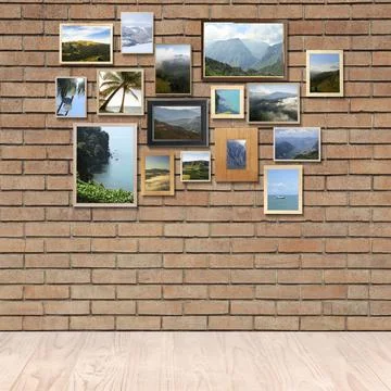 Many beautiful landscapes in frames on brick wall in room Stock Photos