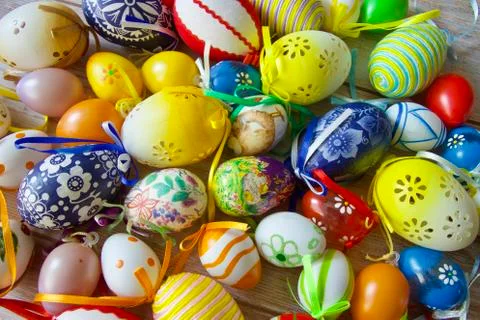 Many beautiful painted colourful Easter eggs stacked on a table Stock Photos