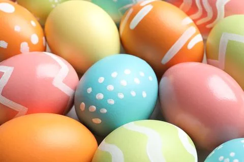 Many beautiful painted Easter eggs as background, closeup Stock Photos