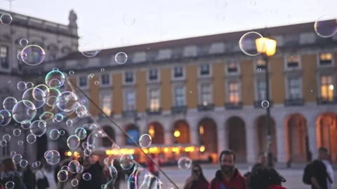 Many beautiful soap bubbles fly city background. Fun performance. Street show. Stock Footage 272761619