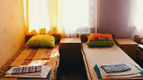 Many beds in children's camp or hospital Stock Footage 80960838