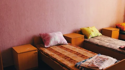 Many beds in children's camp or hospital Stock Footage 80960871