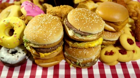 Many Beef Burger and doughnut on the table on background. unhealty junk foods Stock Footage 336579533