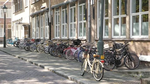 Many Bikes in Front of Dutch Primary School Stock Footage 148374074