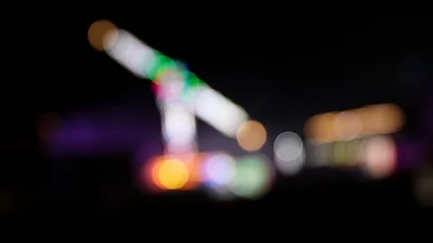 Many blinking defocused lights of a carnival at nigth Stock Footage 120138246