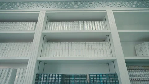 Many books in Hebrew on the shelf in a synagogue Stock Footage 233968974