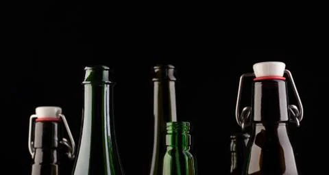 Many bottles on black background studio shot 스톡 사진