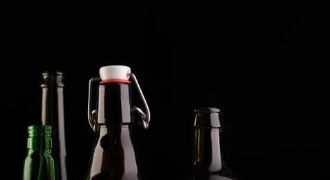 Many bottles on black background studio shot Foto stock