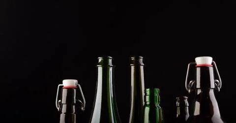 Many bottles on black background studio shot Foto stock
