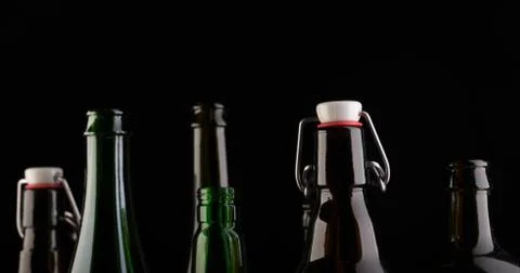 Many bottles on black background studio shot Foto stock