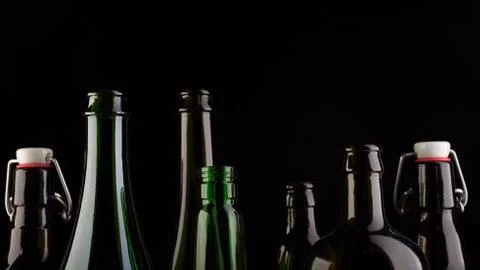 Many bottles on black background studio shot 스톡 사진