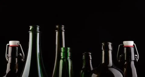 Many bottles on black background studio shot Foto stock