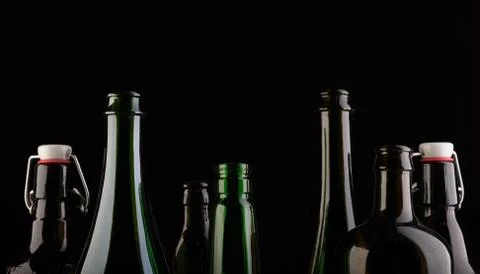 Many bottles on black background studio shot Foto stock