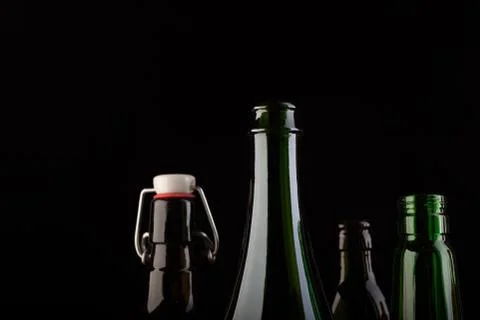Many bottles on black background studio shot Foto stock