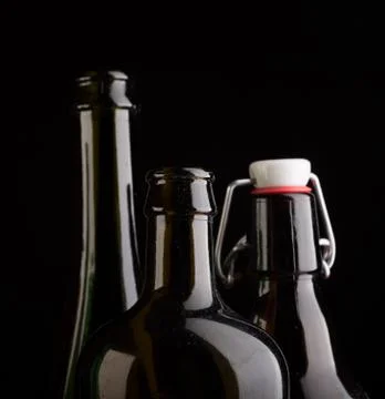 Many bottles on black background studio shot Stock Photos