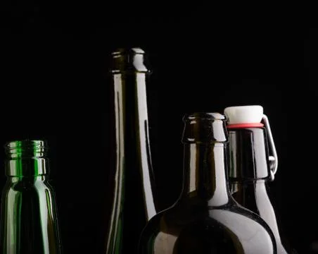 Many bottles on black background studio shot 스톡 사진