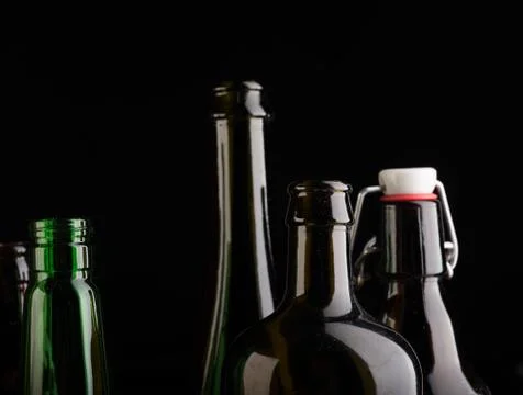 Many bottles on black background studio shot 스톡 사진