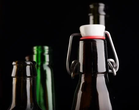 Many bottles on black background studio shot Foto stock