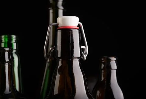 Many bottles on black background studio shot Foto stock