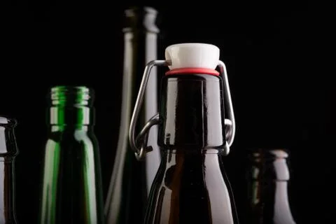 Many bottles on black background studio shot 스톡 사진