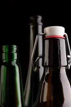 Many bottles on black background studio shot Foto stock