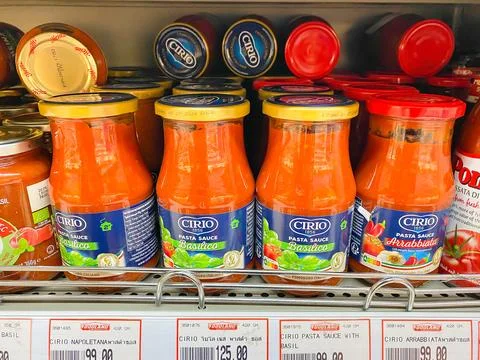 Many bottles of Cirio Pasta sauce with price and on the shelf Stock Photos