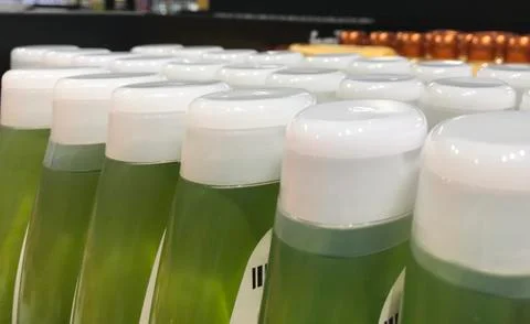 Many bottles, cosmetics in plastic packaging liquid shampoos Stock Photos