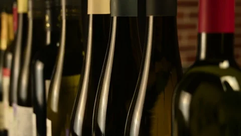 Many bottles of wine stand in a row in the cellar Video stock 121854584