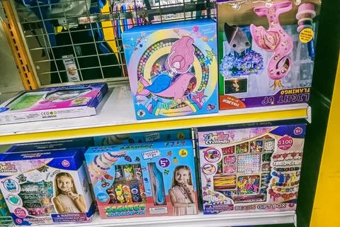 Many boxes contain beads for children's games Stock Photos