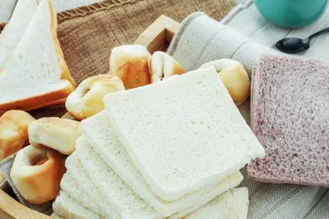 Many breads and cup. Stock Photos