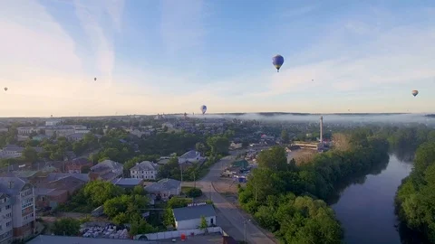 Many  bright balloon over city in summer morning 스톡 동영상 80279879