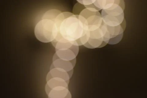 Many bright blurry circles overlapping against dark background 写真素材